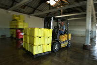 Photo shows a forklift truck in a warehouse