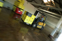 photo shows a forklift truck in a warehouse