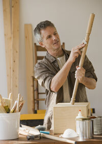 image of a man working with wood