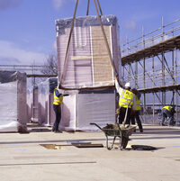 Photo shows workers on a construction site