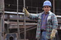 Photo shows a worker on a construction site