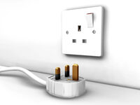 Image shows the plug of a portable appliance near an electrical socket
