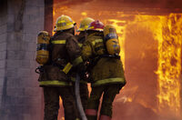 Photo shows firefighters tackling a fire